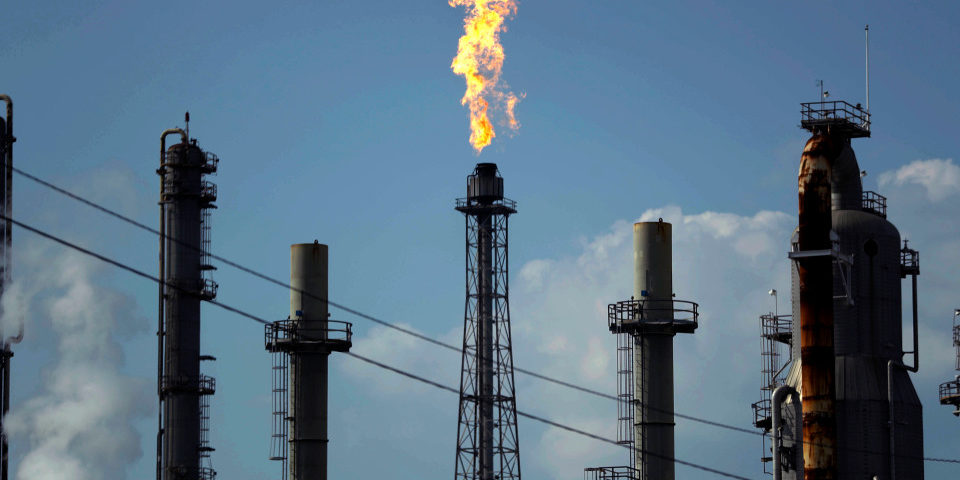 FILE - In this Thursday, Aug. 31, 2017, file photo, a flame burns at the Shell Deer Park oil refinery in Deer Park, Texas. Oil prices are plunging Sunday, March 8, 2020, amid worries that an OPEC dispute will lead a virus-weakened economy to be awash in an oversupply of crude. (AP Photo/Gregory Bull, File)